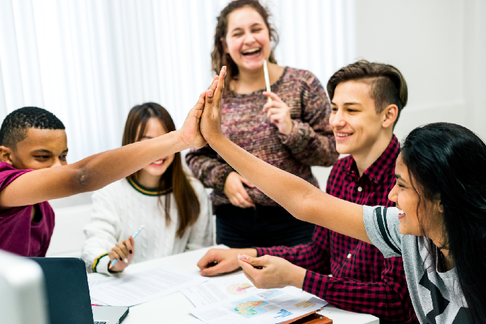 A small group of students working with a teacher in a Growth Gears session.