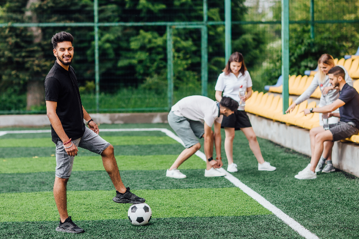 Students performing a drill on the football ground