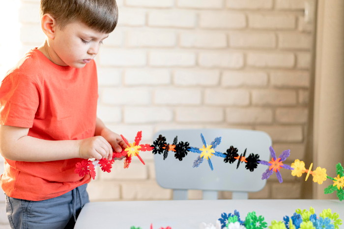 Toddlers exploring geometric shapes inside the safe, child-scaled early years wing at VPLS Seoni.