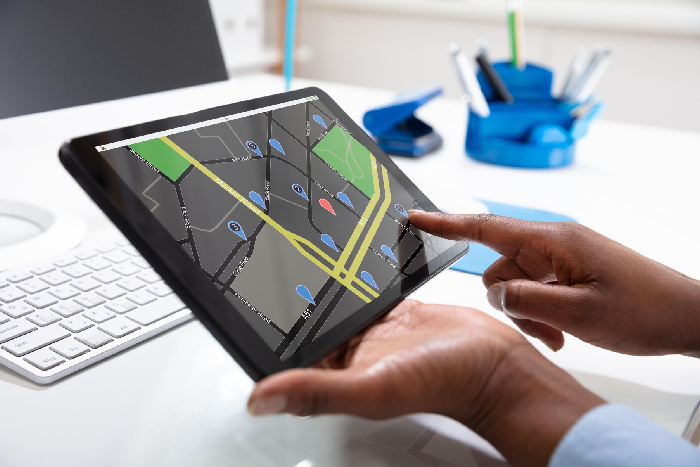 A live transport tracking application open on a tablet screen inside the VPLS Seoni administrative monitoring room.